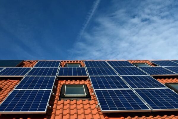 Solar panels on a modern home roof representing property value increase.