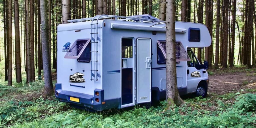 A well-equipped campervan parked in a scenic location, representing travel and adventure.