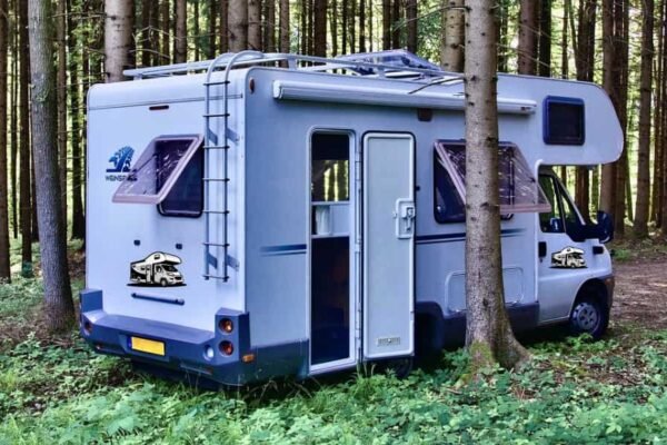 A well-equipped campervan parked in a scenic location, representing travel and adventure.